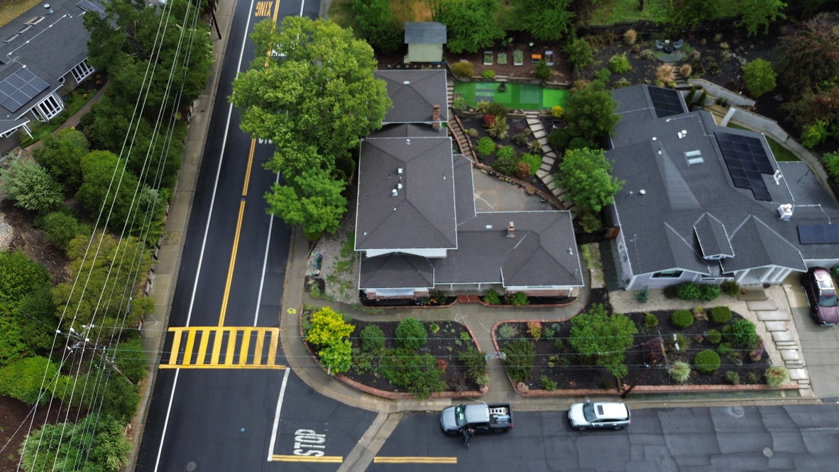 Golden Heights Roofing - Aerial drone view of completed architectural shingle roof on San Rafael homes with landscaped yards