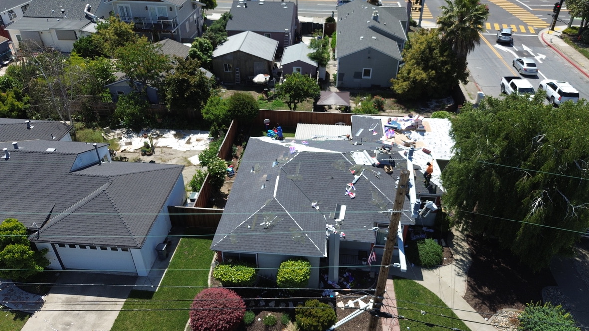 Aerial view of a residential roof replacement in progress in the Bay Area