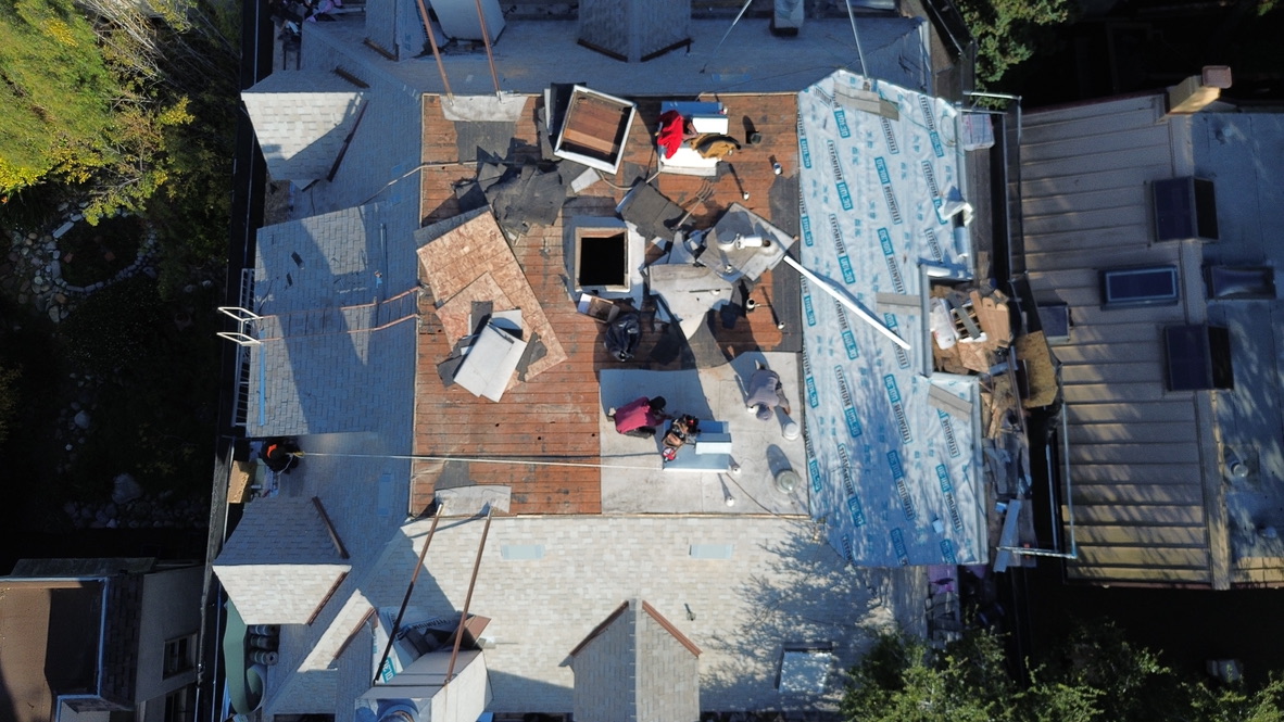 Golden Heights Roofing - Aerial view of a Bay Area home with new underlayment installed during roof replacement before solar panel installation