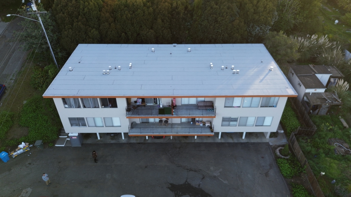 Professional torch down flat roof replacement in progress