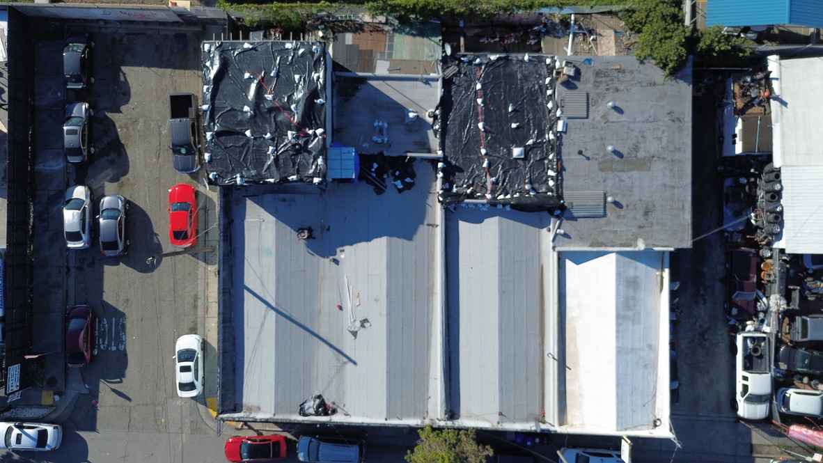 Cool roof granule coating applied to finished torch down system