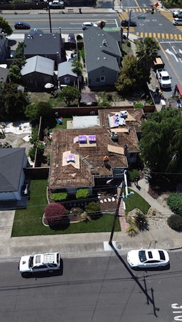 New custom home roof installation with premium architectural materials